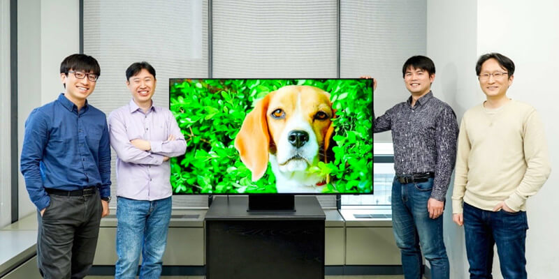 upscaling_samsung Samsung employees standing next to their video upscaling technology